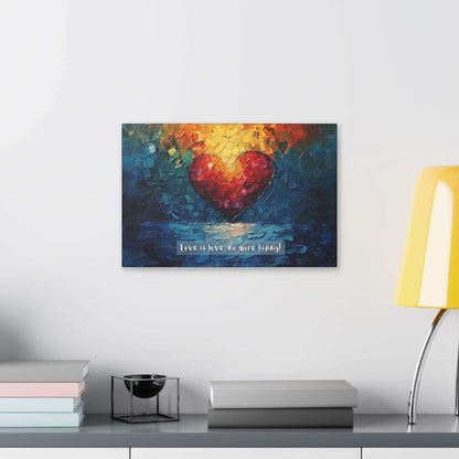 The "Love is Love: Radiant Gay Pride Canvas Wall Art" by Printify (Model PR-6W-002c) features a vibrant painting on polyester canvas. It depicts a large red heart at the center, surrounded by abstract, multicolored brushstrokes in blue, green, yellow, and orange. The text at the bottom reads "Love is love," honoring the LGBTQ+ community with "no more hiding!