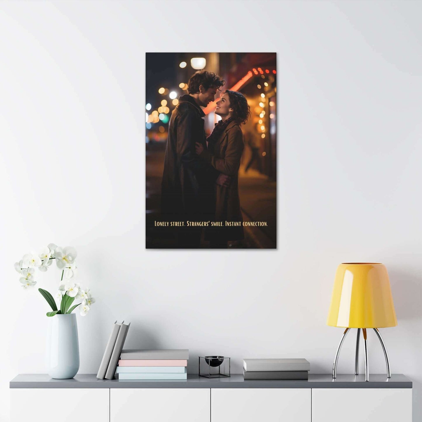 A couple stands close, smiling at each other on a dimly lit street with colorful blurred lights in the background. They appear to be sharing a tender moment, reminiscent of an urban love painting. The text at the bottom reads, "Lonely street. Strangers' smile. Instant connection." This scene is beautifully captured in Printify's "Strangers' Connection: Romantic Canvas Wall Art with 6-Word Love Story.