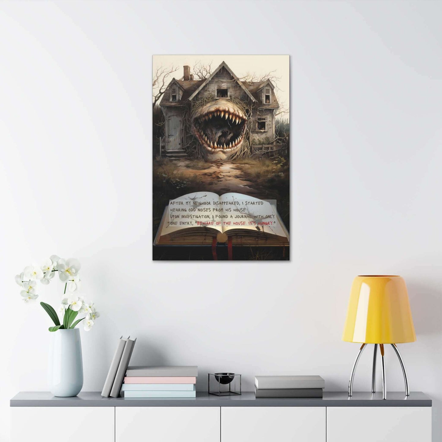 Titled "The House Hungers: Nightmare Canvas Wall Art with 2-Sentence Horror Story" by Printify, this surrealistic painting depicts a spooky, dilapidated house with a monstrous, wide-open mouth as its entrance. In the foreground lies an old book that ominously states: "AFTER MY NEIGHBOR DISAPPEARED, I STARTED HEARING ODD NOISES FROM HIS HOUSE. UPON INVESTIGATION, I FOUND A JOURNAL.”