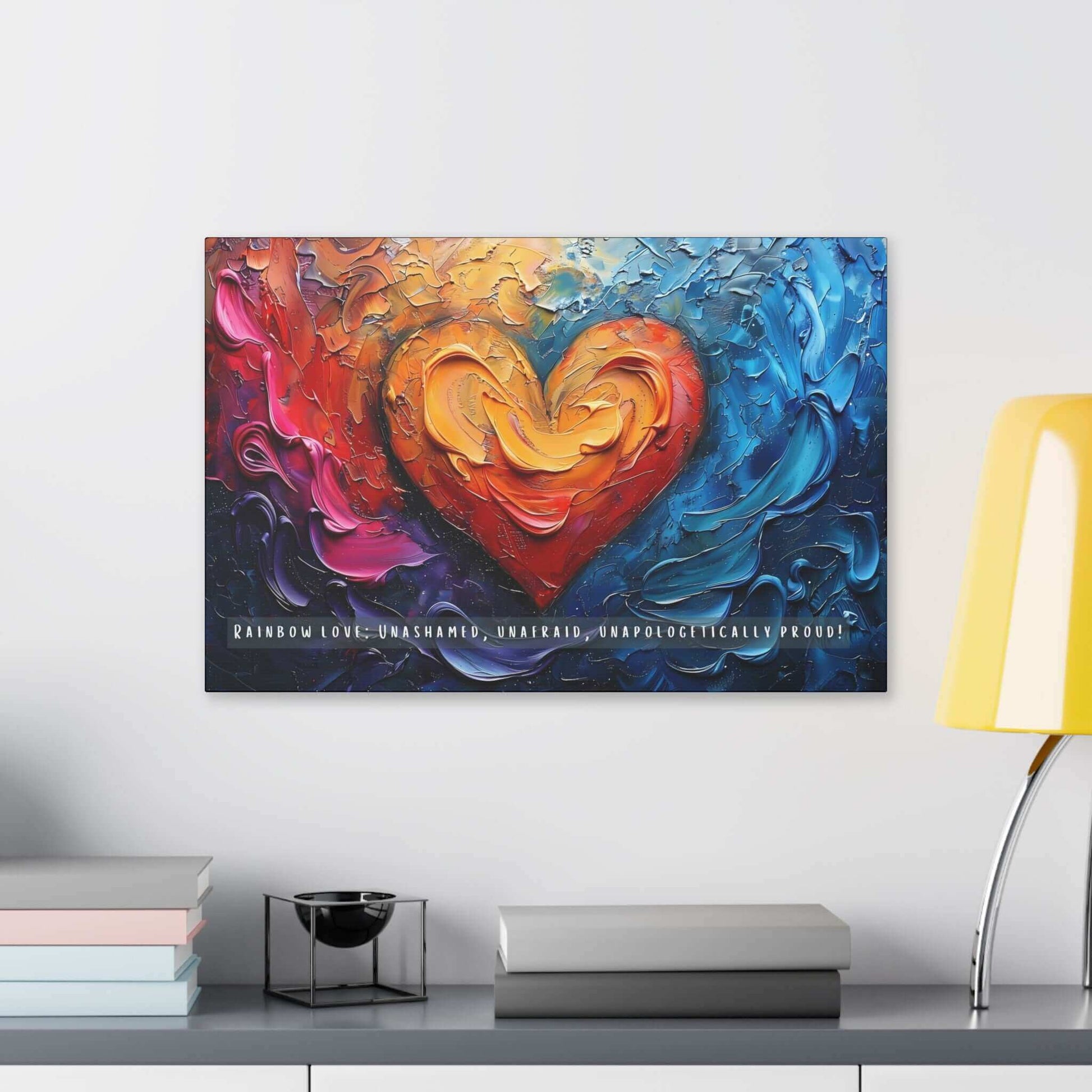 The Rainbow Love: Bold Gay Pride Canvas Wall Art by Printify (PR-6W-004c) features a vividly colorful painting with a heart at the center, surrounded by swirling abstract patterns in shades of red, orange, yellow, blue, and purple. At the bottom, it proudly displays the text: “RAINBOW LOVE: UNASHAMED, UNAFRAID, UNAPOLOGETICALLY PROUD!”—a vibrant celebration of diversity and pride within the LGBTQ+ community.