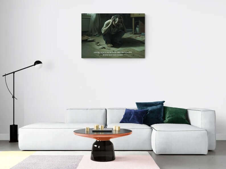 A distressed man crouches on the floor in a dimly lit room, clutching his head with both hands. Scattered papers and items lie around him. The text overlay reads: "Phantom Screams: Hyperreal Haunted Canvas Wall Art with 2-Sentence Horror Story" by Printify. "Every night I hear the phantom screams coming from the basement. My house doesn't have a basement.