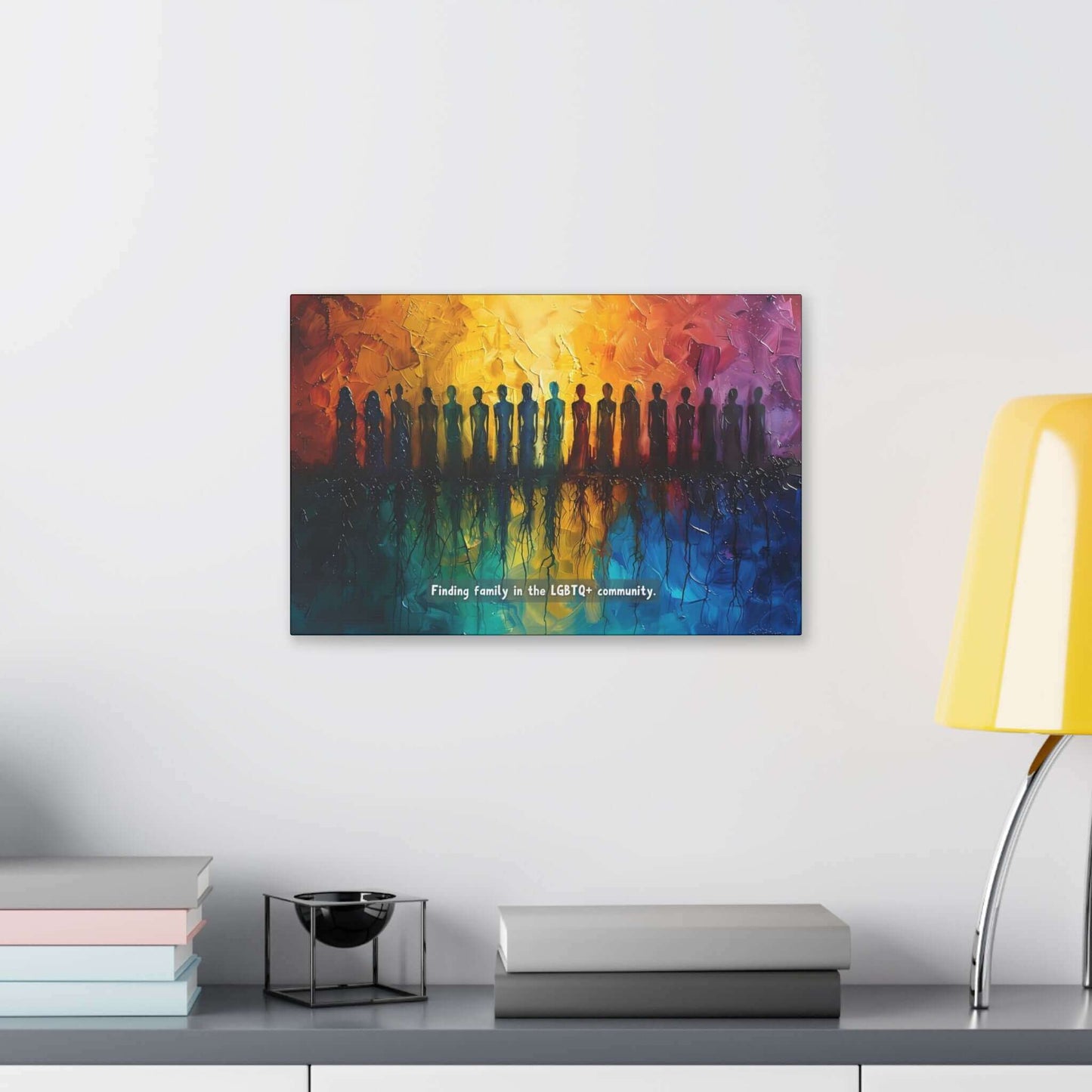 A vivid canvas from Printify, titled "Roots of Pride: Inspiring Gay Pride Canvas Wall Art," depicts a diverse group of silhouetted figures standing in a row. The background transitions seamlessly from warm oranges and yellows to cool blues, reflecting the figures below. Text reads: "Finding unity and pride in the LGBTQ+ community.