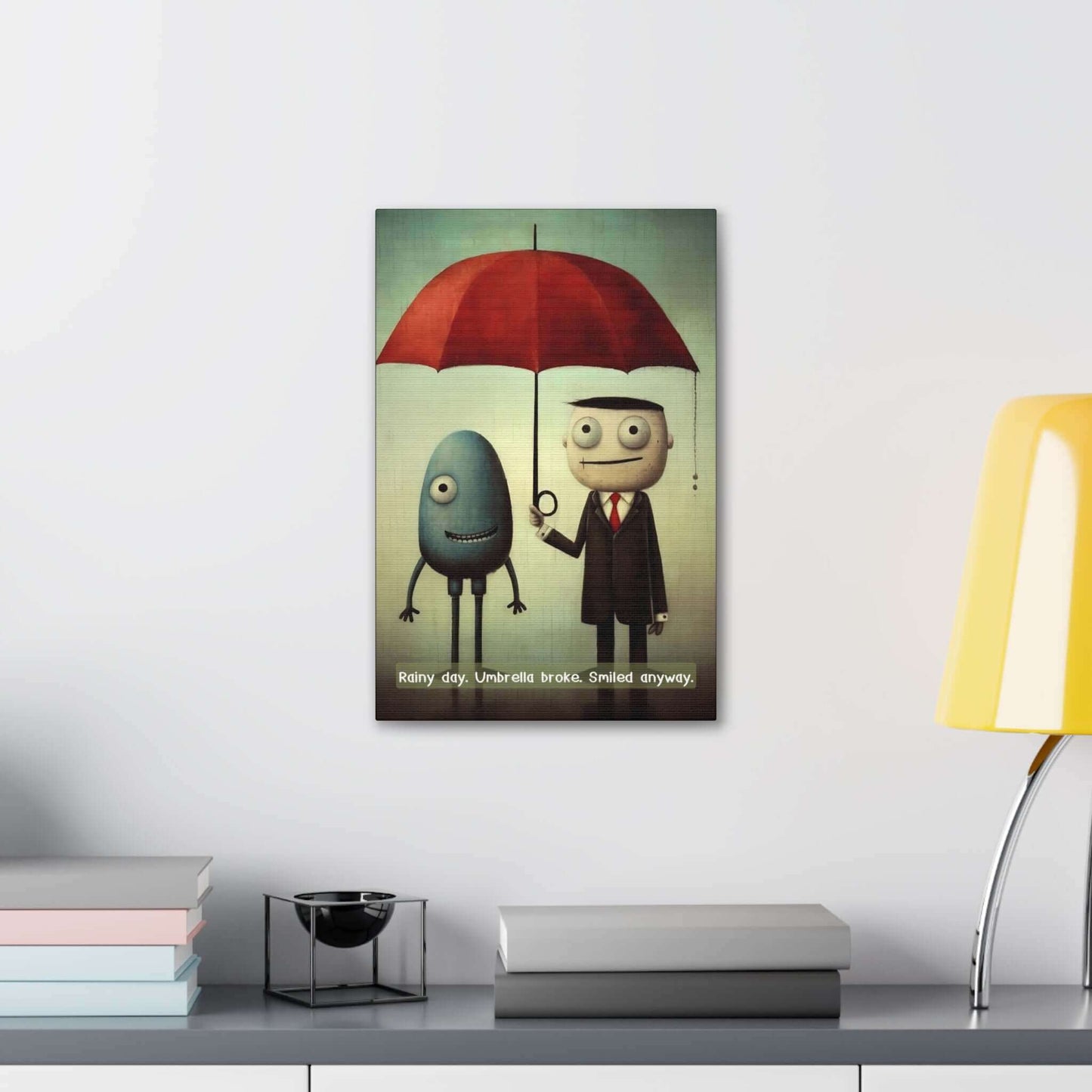 A whimsical canvas wall art by Printify titled "Smiling Through the Rain: Whimsical Canvas Wall Art with Positive 6-Word Story," featuring two cartoon characters standing under a red umbrella. An egg-shaped blue figure with one leg smiles beside a man in a suit and tie holding the umbrella. The text reads, "Smiling Through the Rain. Umbrella broke. Smiled anyway.