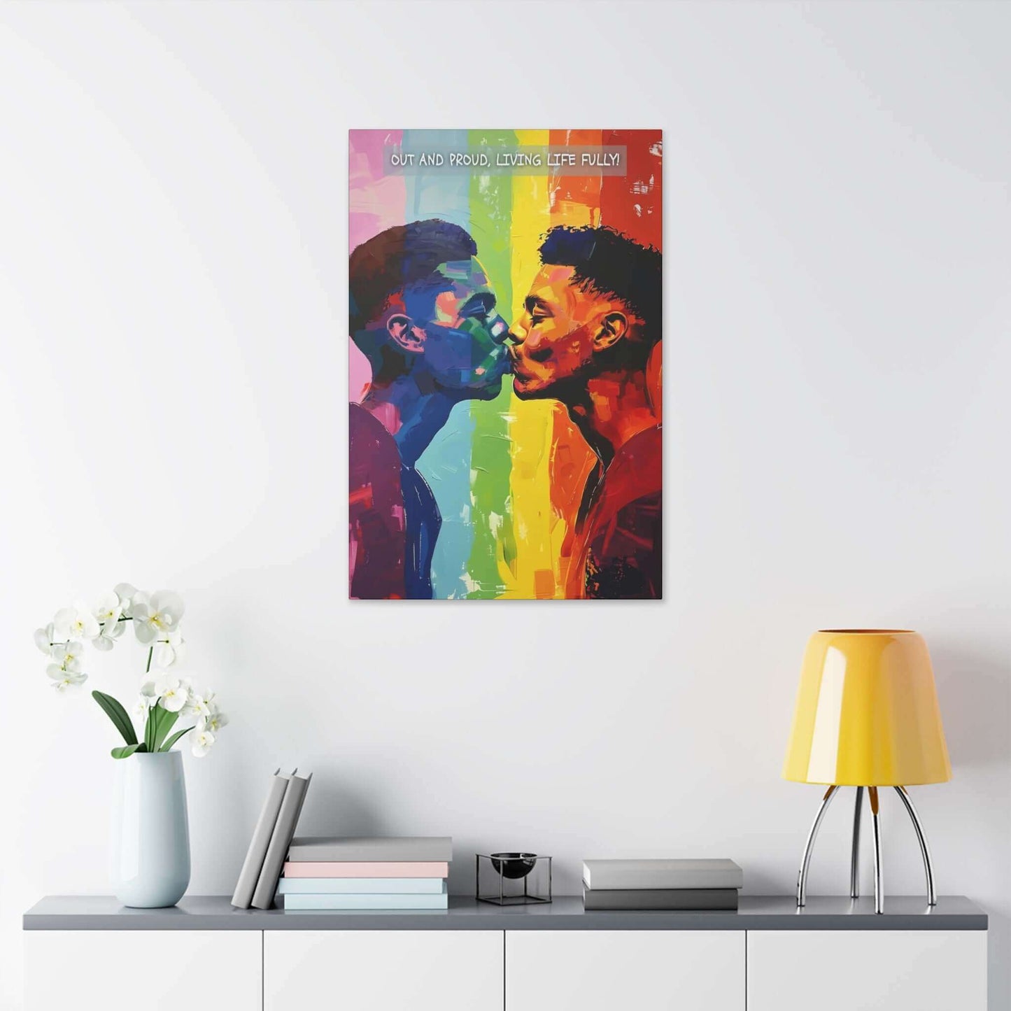 Printify's "Living Fully: Vibrant Gay Pride Canvas Wall Art, Inspired by Joyful 6-Word Story | PR-6W-006c" features an expressive and artistic painting of two men leaning in for a kiss against a rainbow gradient background. The text at the top reads, "Out and proud, living life fully!" rendered with bold and dynamic brushstrokes to celebrate love vibrantly.