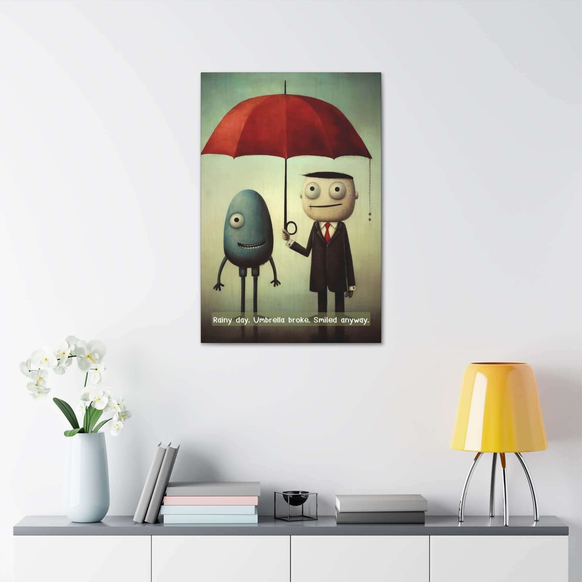 A whimsical canvas wall art by Printify titled "Smiling Through the Rain: Whimsical Canvas Wall Art with Positive 6-Word Story," featuring two cartoon characters standing under a red umbrella. An egg-shaped blue figure with one leg smiles beside a man in a suit and tie holding the umbrella. The text reads, "Smiling Through the Rain. Umbrella broke. Smiled anyway.