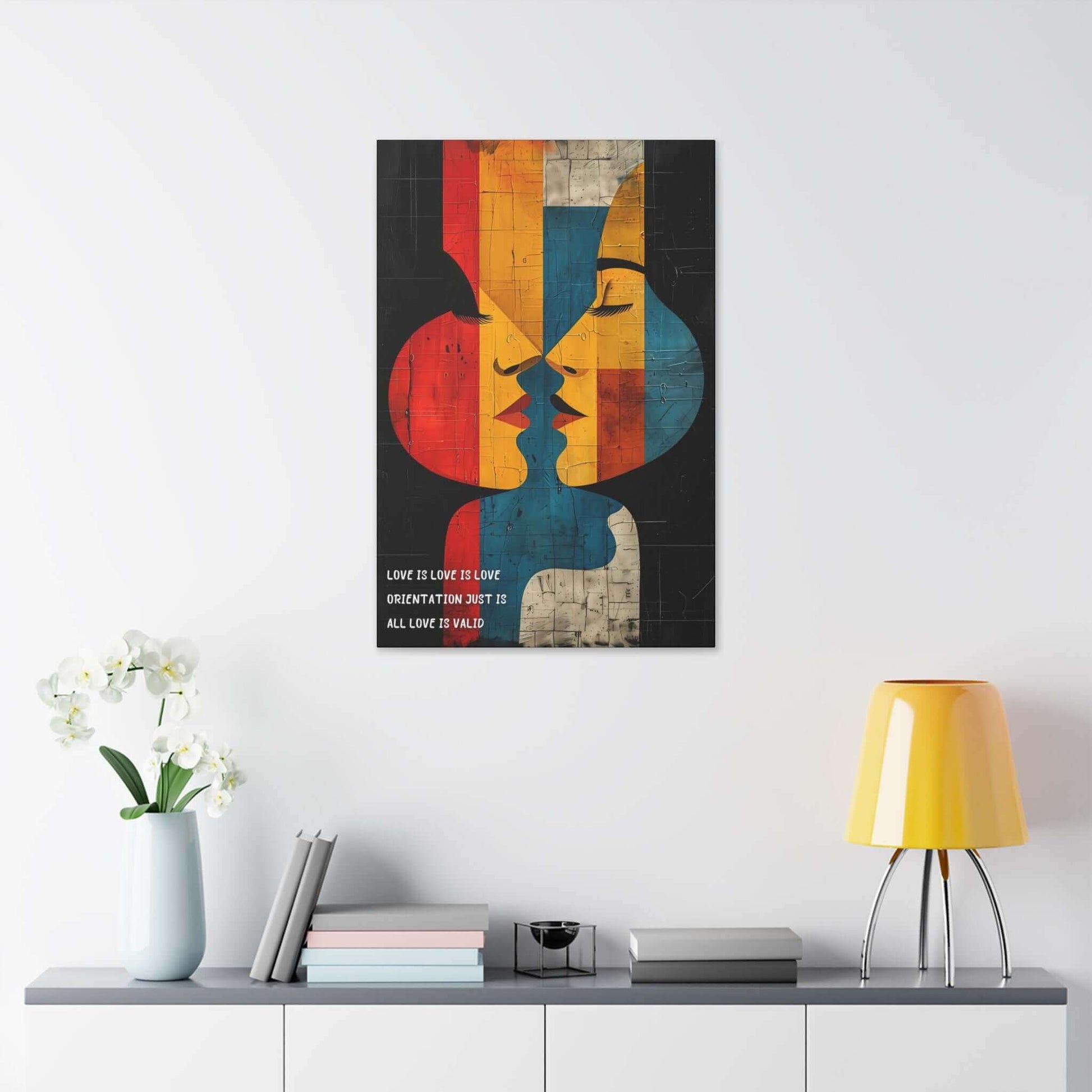 Abstract Pride canvas wall art with two faces in vibrant geometric shapes celebrating diversity and love, inspired by a haiku "Love is love is love."