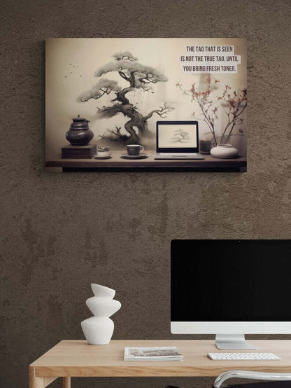 A minimalist office with a wooden desk featuring a modern computer setup and a stack of white sculptural objects. Above the desk is Printify's Asian-Inspired Canvas Wall Art with Bonsai & Clever Haiku, showcasing a tree, tea set, laptop, and the text: "The Tao that is seen is not the true Tao, until you bring fresh toner.