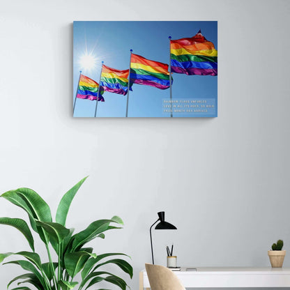 A collection of Bold Rainbow Flags Canvas Wall Art from Printify is shown flying in the breeze against a clear blue sky, with sunlight shining brightly in the background. The text on the vibrant Pride Month Art Print reads, "RAINBOW FLAGS UNFURLED LOVE IN ALL ITS HUES, SO BOLD PRIDE MONTH HAS ARRIVED," celebrating the LGBTQ+ community.