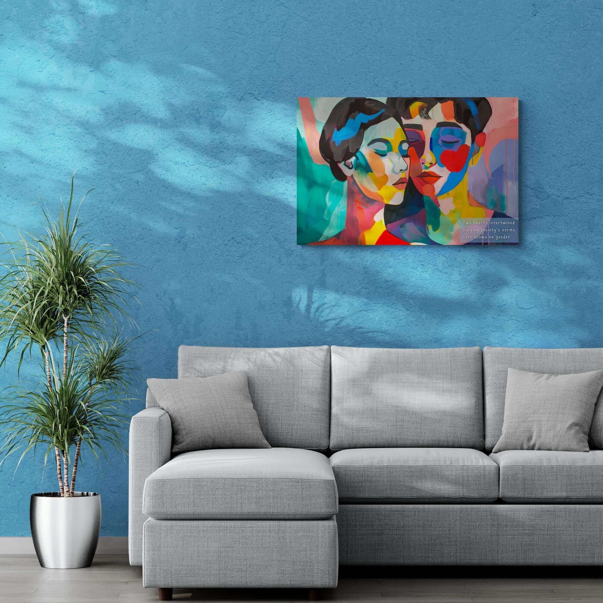 Intertwined Love vibrant abstract couple canvas wall art above gray sofa in modern living room with blue wall and plants